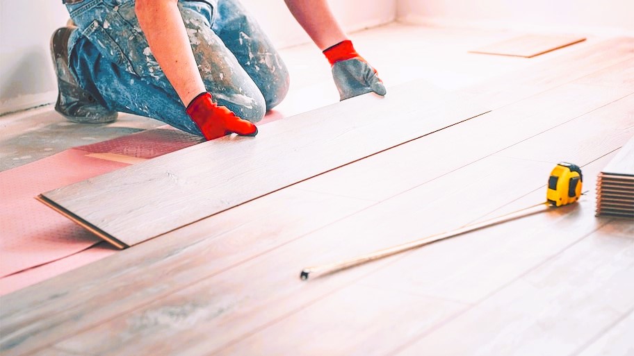 Professional installing flooring